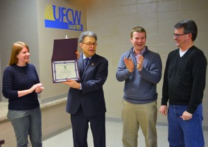 Sen. Al Franken cracks up the Minnesota Fair Trade Coalition leadership team while accepting his award. From L to R: coalition chair Kera Peterson, Franken, director Josh Wise and treasurer Russ Hess.