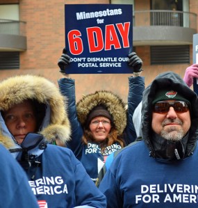 Advocates of preserving six-day mail delivery rally outside the main Minneapolis Post Office.