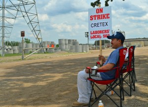 Cretex worker Arturo Sanchez mans the picket line outside the company's Shakopee facility, where members of Laborers Local 563 are on strike to keep their defined-benefit retirement plan.
