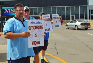 Machinists Local 1833 members picketing outside Terminal 1 today include (L to R) Derrick Bollea, A.J. Lindell and Greg Durand.