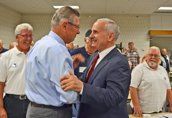 Gov. Mark Dayton (right) greets Minnesota AFL-CIO President Emeritus Bernard Brommer at the Minnesota State Retiree Council convention.