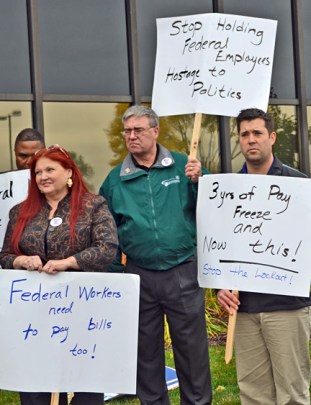 AFGE members Vicky Sirovy, Gary Schabert (middle) and Jared Thyen ask U.S. Rep. Erik Paulsen to end the federal government shutdown.