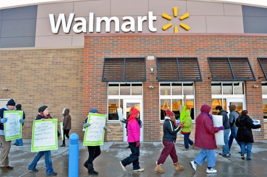 Labor, faith and community supporters picket outside Walmart in Brooklyn Center as three associates inside inform their manager they are going on strike.