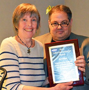St. Paul RLF President Bobby Kasper presents Biz O’Mara with the 2013 Humanitarian Award for her career as liaison between labor and United Way.