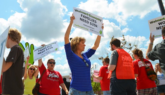 Supporters set up a picket line outside the Walmart in Brooklyn Center, where two associates, members of OUR Walmart, are on strike this week.
