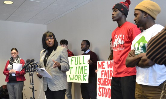 Hourly workers listen as Rep. Rena Moran (second from left) describes her bill to bring balance to the state's work scheduling laws.