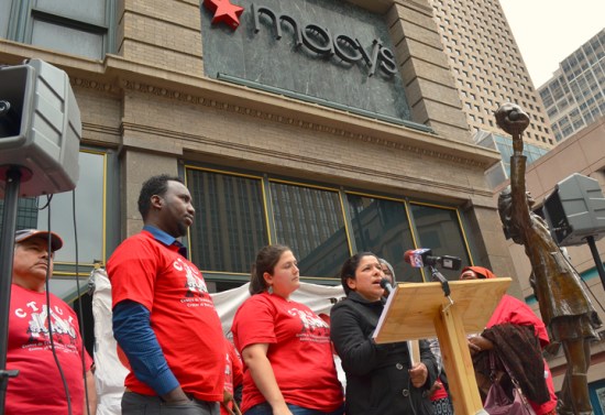 CTUL member Maricela Flores speaks at a press conference announcing a class-action lawsuit seeking unpaid wages for workers who cleaned Macy's and Herberger's stores in the Twin Cities.