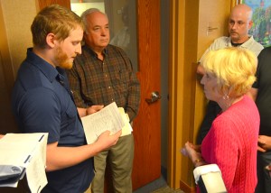 Bethesda Hospital President Cathy Barr rejects a request from Kyle McGinn (L) that HealthEast recognize a majority of officers' request to form a union. 
