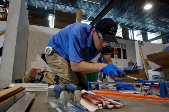 Brandon Peterson competes in the BAC IMI International Apprentice Contest's tiling category. Photo courtesy © BAC/Todd Buchanan 2015