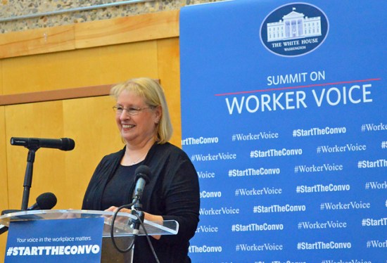 Renee Brand, who works at the New Flier bus plant in St. Cloud, introduces Labor Secretary Tom Perez at the Worker Voice Summit in Minneapolis. "I'm living proof manufacturing is alive in the U.S.," the CWA member said.