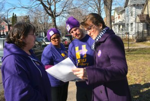 SEIU President Mary Kay Henry (R) knocks doors in support of Hillary Clinton with Local 284 member Nate Mathias and SEIU Healthcare MN member Robin Pikala (L).