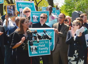 Sen. Katie Sieben of Newport, a lead propoent of paid family leave, leads a rally outside the Capitol.