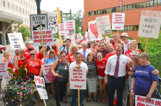 Striking nurses on the picket line outside United Hospital paused for a photo with members of the St. Paul City Council.