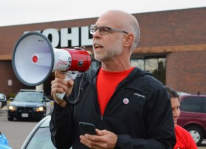 St. Paul Federation of Teachers Vice President Nick Faber speaks at a rally outside Kohl’s in Roseville.
