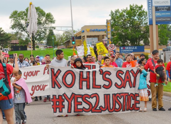 Janitors and their supporters march along County Road B2 in Roseville, near Rosedale Mall.