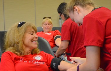 Striking United Hospital nurses Jennifer Mlodzik (L) and Linda Clute give blood at a union-sponsored blood drive near their picket line.