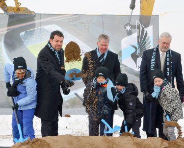 MN United’s Nick Rogers (L), Mayor Chris Coleman and Dr. Bill McGuire (R) supervised a crew of youth soccer players at the new stadium's groundbreaking ceremony Monday.