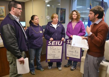 SEIU Healthcare Minnesota members (L to R) Pam Ganser, Amy Pauly and Jodi Klembrook delivered a petition opposing Andy Puzder as labor secretary to Sen. Al Franken's office in Minneapolis.