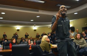 Mike Griffin, field director for Neighborhoods Organizing for Change, rallied opponents of the local preemption bill during the House jobs committee's unexpected dinner break.