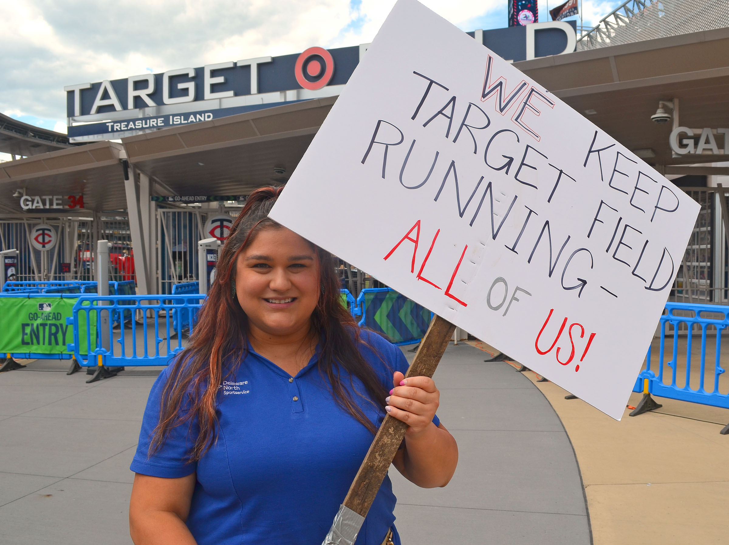 Roxy Hoda holding a picket sign outside Target Field