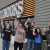 Workers with fists raised outside a Half Price Books store